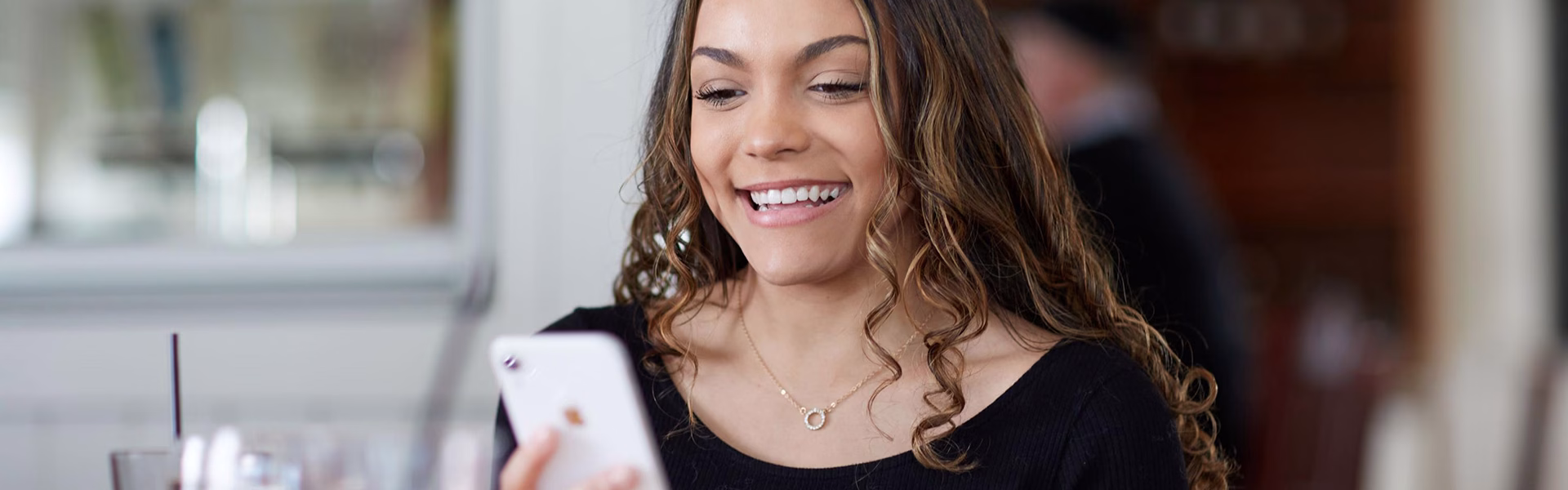 Young woman using her mobile app on her phone.